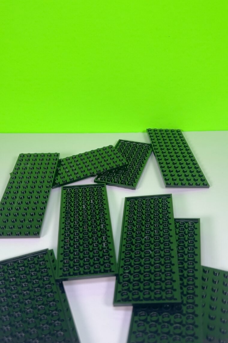 Black base LEGO bricks on a table