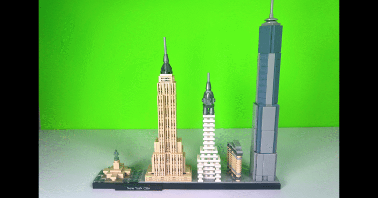The LEGO Skyline of New York City fully built with a bright green background