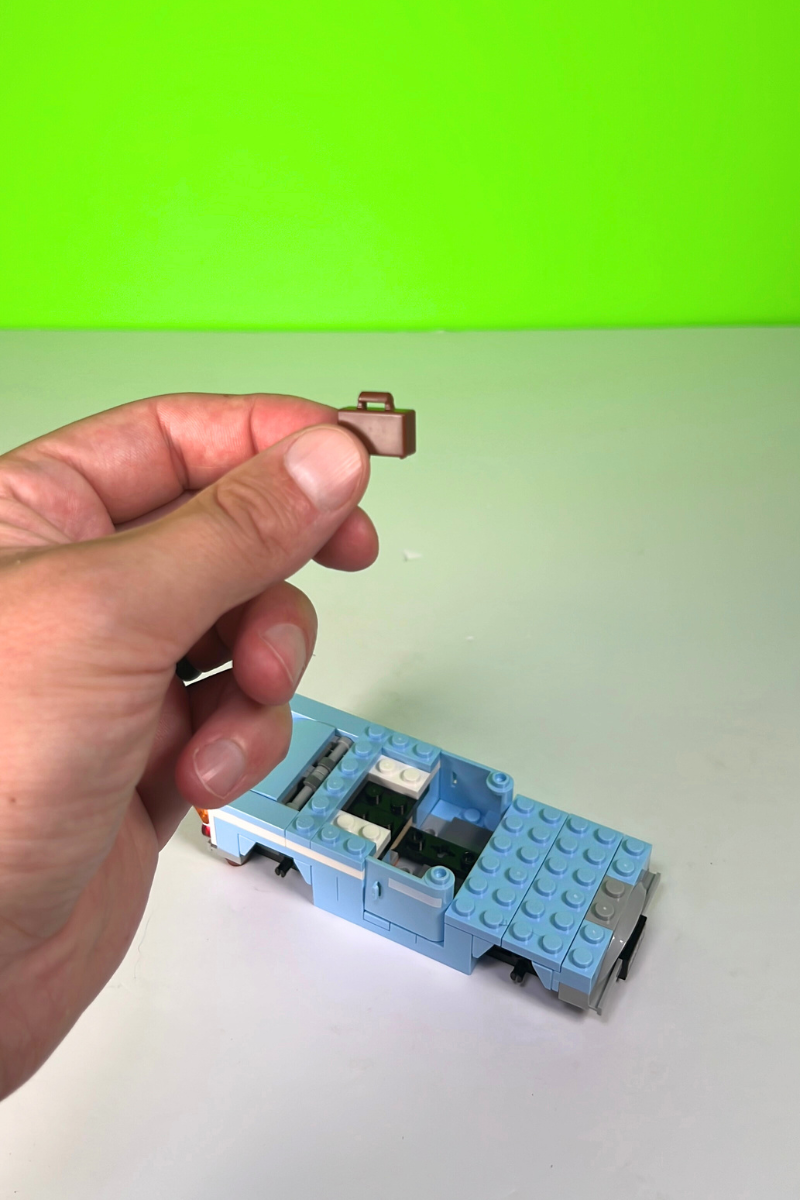 A small brown LEGO suitcase