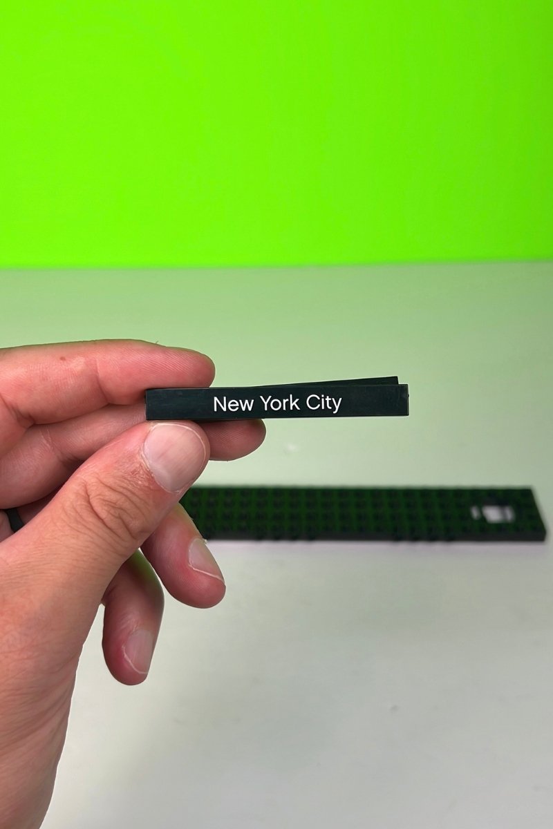 LEGO piece that has 'New York City' etched in white on it